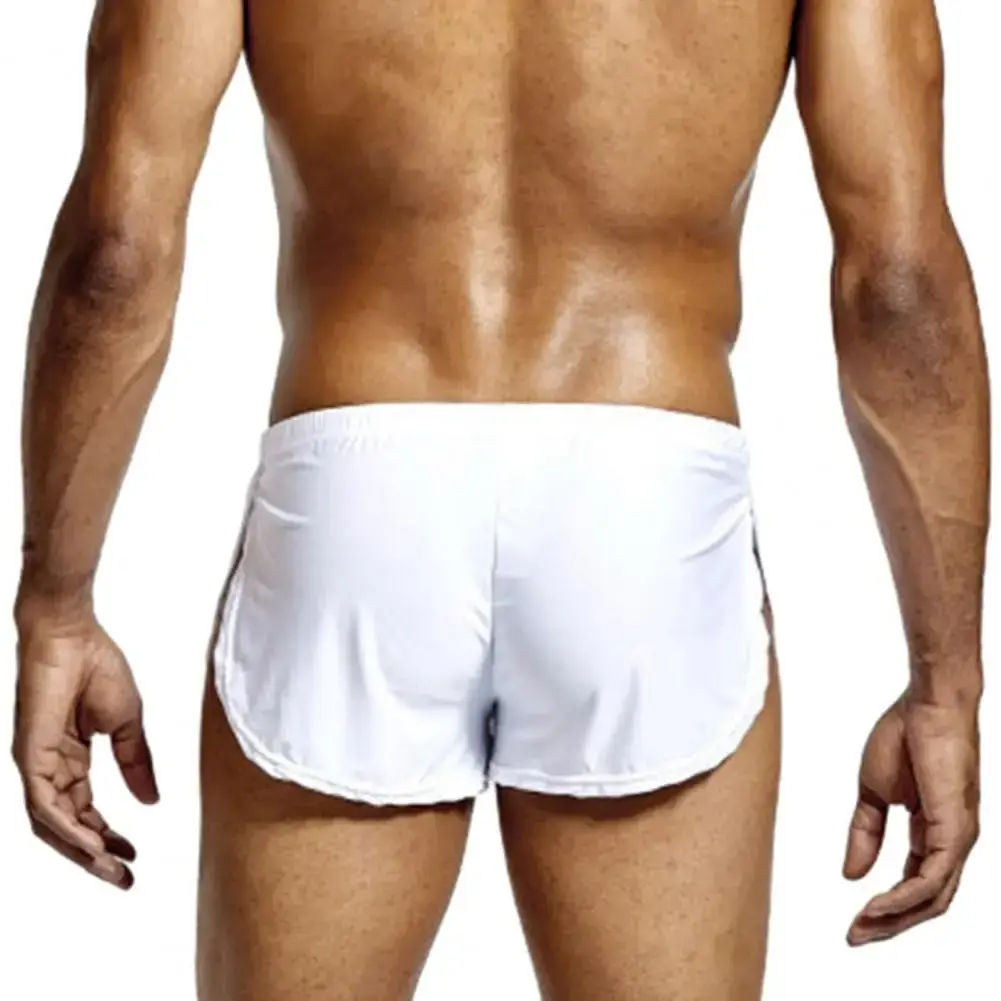 Short taille basse respirant pour hommes, couleur unie, culotte taille élastique, fente latérale, short de salon en soie glacée, sous-vêtements de nuit