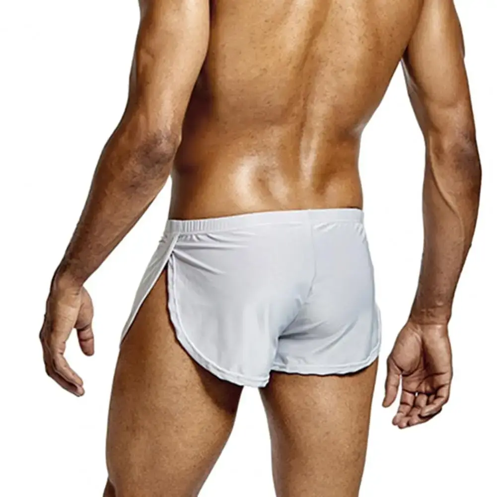 Short taille basse respirant pour hommes, couleur unie, culotte taille élastique, fente latérale, short de salon en soie glacée, sous-vêtements de nuit